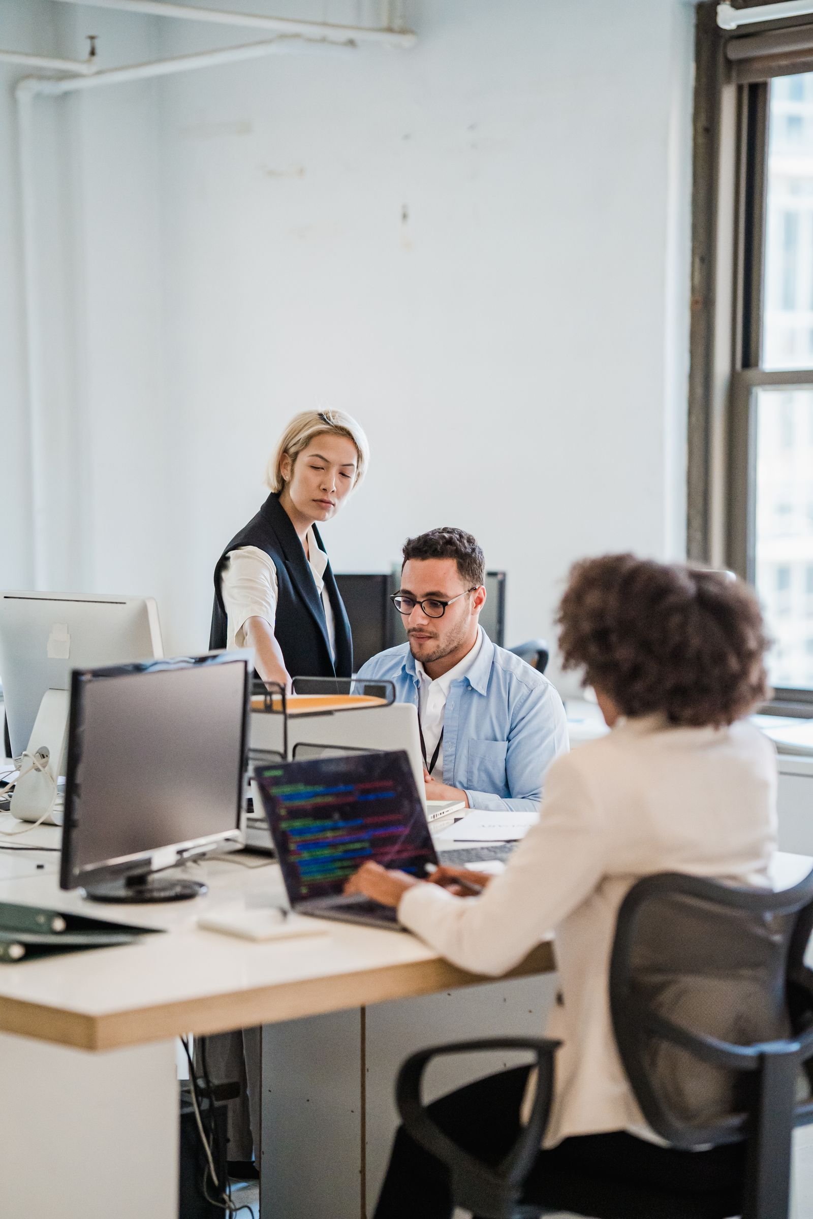 Business support team working together in a modern office